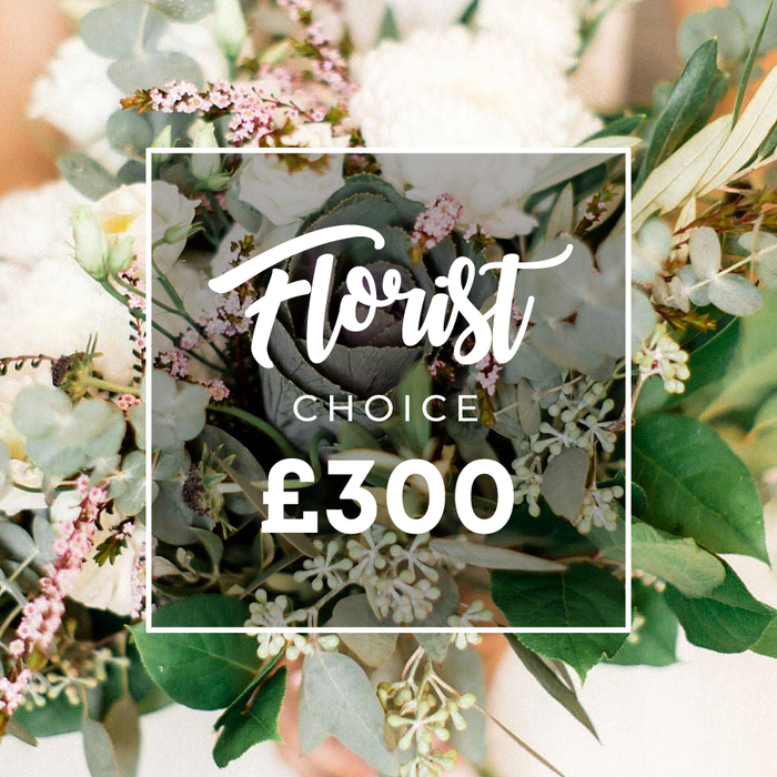 Set against Oxford's sunlit streets, this Florist Choice bouquet radiates ceremonial grace. The dominant creamy white blooms-garden roses, peonies, or chrysanthemums-are artfully arranged with smaller white lisianthus or campanula, and interwoven with pale pink mauve fillers. The greenery is abundant: rounded eucalyptus, slender olive branches, and clusters of tiny pale green berries that suggest fresh growth. In the center sits a darker green, almost purplish ornamental kale or a unique succulent head, offering a modern, sculptural point of focus. A white frame bearing Florist Choice floats above the arrangement, with Florist in flowing script, CHOICE in uppercase beneath, and the price ?300 displayed proudly. The background softens to peach and cream, ensuring the bouquet commands attention in Oxford's windows and on local delivery routes.
Designed with occasions in mind, this bouquet is ideal for graduations, anniversaries or a heartfelt congratulations. Its refined balance of bold, statement blooms and delicate filler creates a versatile gift that suits halls of residence near Jericho, residential streets around Headington, or a doorstep on Oxford's University Parks side. The piece speaks of expert curation and dependable freshness, available for delivery across the city, often the same day, ensuring that the moment is captured while the flowers are at their peak.
With its elegant composition and contemporary edge, this Florist Choice arrangement carries a sense of celebration and warmth, a thoughtful gesture to mark a milestone or to lift spirits in a busy city. It's the sort of bouquet you picture arriving in a crisp box on a doorstep near the river Isis, ready to brighten a room and a day.