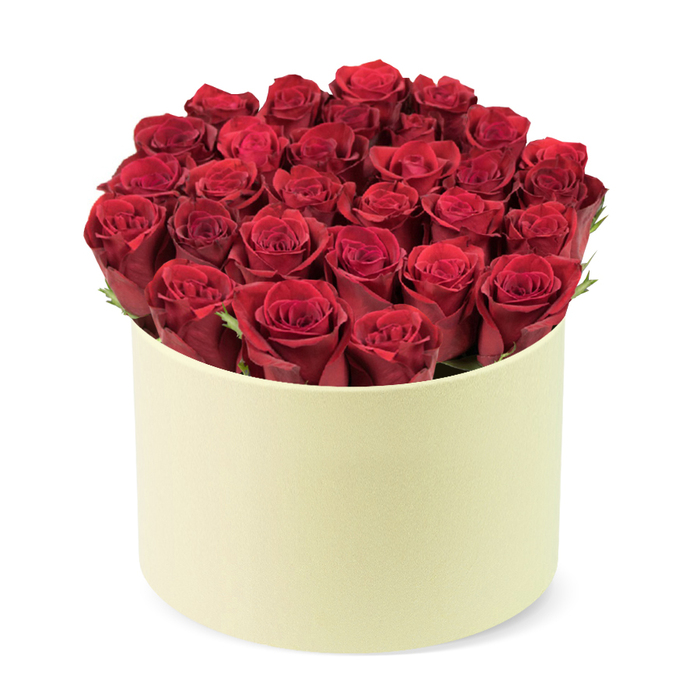 An exquisite, high-quality arrangement by Flowers Oxford features approximately two dozen deeply rich, velvety red roses, densely packed to fill a round, creamy ivory hat-box. Each rose shows tightly furled petals, some revealing the spiral of a partially opened bud, a hint of life just about to bloom. Subtle hints of dark green foliage peek between the heads, offering a natural contrast that keeps the palette intimate rather than overpowering. The container is a smooth, matte box in pale ivory with a slightly warm undertone, setting off the roses' velvet texture and deep color.

The shot is taken against a clean white background, isolating the bouquet as a premium, gift-ready piece. From the three-quarter, slightly elevated angle, you can sense the careful craftsmanship; every stem placed with precision so the dome holds its soft, sculptural form. This is more than a bouquet; it's a compact statement of love and appreciation, perfect for romantic occasions or meaningful milestones. In Oxford, it travels with ease for Valentine's Day, anniversaries, or milestone birthdays, with dependable same-day delivery across central districts, North Oxford, and the Jericho corridor. The aroma is a whisper of rose, a sensory cue that lingers long after the bouquet is unpacked, a reminder of the thoughtful touch from Flowers Oxford.