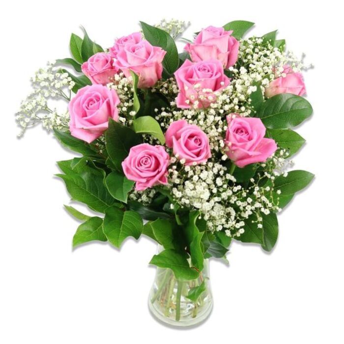 In this image, a generous bouquet of approximately ten to twelve pink roses is artfully arranged in a clear glass vase, set against a pristine white background that allows every colour and texture to shine. The roses are the undeniable stars: their petals move through a spectrum of pink shades, from soft pastel blush at the outer edges to more medium rosy tones nearer the centre, forming dense, velvety whorls. Some blooms are open and expansive, their centres fully revealed, while others are still partially closed, suggesting recent cutting and excellent freshness. Interspersed among the roses are abundant tufts of white baby's breath, each spray dotted with countless tiny blossoms that resemble a fine, airy mist. These dainty white flowers create a gentle contrast and bring a sense of lightness, almost like a soft cloud cradling the richer pink blooms. Deep green rose foliage surrounds and supports the flowers, the leaves sturdy and slightly glossy, framing the bouquet like a natural border. The stems are gathered neatly into a simple, cylindrical glass vase, half-filled with clear water; through the transparency, the straight green stems and a few tiny air bubbles are visible, reinforcing the sense of just-arranged freshness you might find in a well-loved Oxford florist near the High Street. The lighting is bright and even, without harsh shadows, accentuating the bouquet's fullness and the velvety texture of the petals. The overall mood is gentle, romantic, and welcoming, perfectly suited for celebrating a new baby in Oxford's family neighbourhoods such as Headington or Summertown. It feels like a heartfelt, traditional gift that could sit on a bedside table in a maternity ward or brighten a living room as parents return home with their newborn.