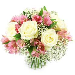 A rounded, hand-tied bouquet of white roses, pink alstroemeria, and feathery white baby's breath is carefully arranged against a spotless white backdrop, evoking the calm, bright light of a tidy Oxford sitting room. At the heart of the design, several creamy white roses open in layered spirals, each petal overlapping the next with a soft, velvety texture that suggests both luxury and tenderness. Their centres reveal a faint wash of pale yellow, adding subtle warmth and making the blooms feel alive rather than stark. Threaded between these classic roses are clusters of alstroemeria in cheerful shades of pink and fuchsia. Their elongated petals curl slightly at the tips and are patterned with fine stripes and freckles in deeper tones, giving the bouquet a playful, contemporary accent. Sprays of baby's breath are tucked among every cluster, their numerous tiny flowers creating a light, misty halo that fills the spaces without ever looking heavy. Fresh green leaves, smooth and slightly glossy, emerge from beneath the blossoms, providing contrast and echoing the greenery of Oxford's parks and college gardens. The stems are trimmed to an even length and bound together at the bottom, clearly presented as a professional hand-tied bunch, ready to be placed in water. The lighting is bright and even, picking up every curve of petal and vein of leaf, while the clean white background keeps all attention on the flowers themselves. This bouquet feels serene and affectionate, perfect for sending gentle congratulations after an exam, offering thanks to a helpful neighbour in Headington, or bringing soft colour to a home near Cowley Road.