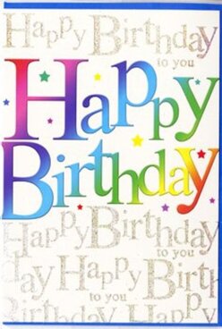 This image shows an exuberant birthday card whose front feels as lively as a weekend crowd wandering through Oxford's Covered Market. Dominating the centre, the phrase "Happy Birthday" is written in large, confident letters, each one cloaked in a different vibrant shade. The colours flow from deep berry reds into rosy pinks, through tangerine and sunshine yellow, melting into fresh grassy greens, turquoise blues, and velvety purples, forming a smooth, painterly gradient. The letters appear slightly raised and glossy, as if they've been carefully printed to give a subtle three-dimensional effect you could feel beneath your fingers. Behind this bold typography, the background is softly filled with repeating lines of "Happy Birthday to you" rendered in fine, looping gold script. The metallic ink shimmers like the late afternoon light along the River Thames in Oxford, adding a refined, almost musical rhythm to the design. Delicate glints of sparkle are scattered throughout, reminiscent of tiny stars or confetti tossed across a birthday table laid out in a Jericho townhouse. The card's surface has a satiny sheen, hinting at a quality finish, while the colour palette radiates warmth and optimism. There is a clear sense of joy and celebration in the composition, yet it remains elegant enough to suit a milestone birthday for a loved one, a colleague, or a close friend. It's the kind of eye-catching greeting you might select to accompany a bright bouquet arranged by a skilled Oxford florist, ready for delivery across areas like Summertown, Cowley, or Botley, turning a simple birthday wish into a full, heartfelt moment.