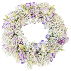 The image shows a serene circular wreath composed almost entirely of fresh white and soft purple flowers, resting against a crisp, white studio background that highlights every contour. The main body of the wreath is formed from luxuriant Baby's Breath, countless tiny white flowers gathered closely together so they resemble a delicate snowdrift, or the pale haze over Port Meadow on a cool Oxford morning. Woven into this cloud-like base are elegant Lisianthus blooms, their ruffled petals adding movement and texture. Each Lisianthus flower opens in creamy white before melting into subtle lavender and deeper violet tones along the edges, as if the colour has been gently painted on. Some blossoms are fully unfurled, exposing layered petals and slightly darker throats, while others remain partially closed, pale green and ivory buds that suggest ongoing life and quiet hope. The wreath's open centre forms a clear, calm circle, reinforcing its symbolism of eternity, unity, and unbroken love. No bold greenery interrupts the palette; instead, the soft whites and purples lie in perfect balance, creating a feeling of hushed dignity. This is the kind of handcrafted tribute a family in Oxford might choose for a funeral, memorial service, or anniversary of passing, to rest by a graveside or beside a framed photograph. The design feels both contemporary and timeless, offering a gentle expression of condolence and remembrance, as though the flowers themselves were whispering a final blessing.