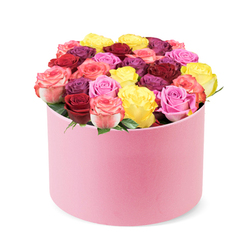 On Oxford's stylish edge, this round pastel pink hat box reads as a modern statement piece. The soft, velvet-like finish of the box catches the light with a quiet sheen, while a pristine white backdrop keeps the focus on the sculpture of blooms within. Dozens of fresh roses rise from the rim in a precise, domed arrangement, a living centerpiece that feels both premium and approachable, as if it could grace a boutique display on Cowley Road or in Jericho's artsy windows.

The colour palette is a bright, confident spectrum: deep crimson and rich magenta anchor the arrangement, while sunny yellow, bubblegum pink, and bi-colour pink-to-cream blooms alternate like brushstrokes. Each rose is perfectly formed, with smooth, velvety petals that catch the eye and hint at long-lasting freshness. The roses are packed densely to create a plush, covetable surface, with just a whisper of green foliage peeking between the blossoms to add natural contrast and depth. The scent is fresh, subtly rosy, and uplifting, enhancing the sense of contemporary luxury.

This contemporary bouquet is a versatile gift for birthdays, anniversaries, or simply to brighten someone's day across Oxford. Its refined energy pairs beautifully with modern interiors, from a city-centre apartment to a cosy living room near Summertown. And because it's available for same-day delivery across the city, you can celebrate without delay, knowing your gesture travels quickly from our studio to the recipient's doorstep through reliable local service.