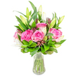 A lovingly composed bouquet of deep pink roses and pristine white lilies sits in a clear glass vase, photographed against a clean white backdrop so every petal and leaf reads plainly. Several large roses dominate the centre, their velvety petals unfolding in layered shades of fuchsia and blush, each bloom carrying a soft, nostalgic sweetness you can almost imagine; the contrast is provided by tall, elegant lily buds and partially opened trumpets whose ivory petals promise a gentle, powdery perfume as they unfurl. The stems are neatly trimmed and visible through the transparent water, the tapered vase giving the arrangement a poised, upright silhouette that would sit beautifully on a mantle or dining table. Around the focal flowers, abundant green foliage - from broad, glossy leaves to finer, lighter-green sprigs - creates a lush, textured backdrop that deepens the pink and white tones while adding movement and volume. Subtle accents of darker burgundy and reddish-brown buds are threaded through the composition, giving small points of shadow and tactile interest that catch the eye. The light here is soft and natural, as I would arrange for a morning delivery to a home near the Covered Market or along the High Street in Oxford, where the bouquet would brighten a kitchen flooded with daylight. As a florist, I choose every stem to suggest celebration, gratitude, or a quiet act of care; this bouquet reads as both joyful and refined, an ideal gift for birthdays, anniversaries, or to lift a friend recovering at home. Its fresh, reassuring presence speaks of thoughtful hands and seasonal care, ready to be placed where it can be seen and smelled daily.