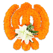 A reverent, hand-crafted floral Khanda captured against a clean white backdrop, composed from hundreds of densely packed bright orange marigold heads that form the symbol's circular chakkar, the two crossed kirpans and the upright double-edged khanda sword. The marigolds' compact, velvety petals give the emblem a warm, tactile surface that catches soft studio light and casts a subtle drop shadow, suggesting the piece is freestanding. At the precise centre where the kirpans intersect, a cluster of large, pristine white lilies rises - at least two fully open blossoms with gently curved petals and pale green-and-yellow stamens clearly visible, surrounded by smaller unfolding lily buds. Sprays of tiny white filler flowers, likely gypsophila, and glossy deep-green foliage tuck around the lilies, their pointed leaves offering a cool contrast to the glowing orange. The overall composition reads as both celebration and devotion: the marigolds' saffron hue evokes festivity and warmth while the white lilies lend calm and dignity. Texturally, the surface ranges from the dense, pom-like marigolds to the smooth, satiny lily petals and the feathery gypsophila, so viewers can almost sense the scent of fresh blooms and the slight spring of packed stems. Made with the careful craft of a local florist familiar with Oxford's community events, this floral Khanda would be appropriate for observances, temple adornment, or community celebrations in neighbourhoods from Jericho to Cowley, offering a respectful, three-dimensional tribute that reads clearly in photographs and in person.