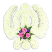 In this photograph, a beautifully composed Sikh Khanda floral tribute stands against a clean, uninterrupted white background, allowing the sacred symbol to speak purely through shape and texture. The full Khanda emblem-the upright sword, the perfectly rounded Chakra, and the pair of crossed Kirpans-has been formed by carefully arranging countless white chrysanthemum flowers in dense, unbroken lines. Each bloom looks freshly opened, with soft, slightly feathery petals that lend the overall design a gentle, comforting texture. The uniform white colouring, leaning subtly toward warm cream, creates a feeling of purity and peace, while the even lighting ensures that the intricate contours of the swords and circle can be clearly read. At the lowest point of the design, nestled between the curved blades of the Kirpans, a small but vivid gathering of accent flowers offers a emotional focal point. Three pink roses, their petals layered and velvety, sit at the centre of this cluster, surrounded by smaller deep purple blooms and sprays of green fern. This pocket of colour introduces tenderness and personal sentiment, echoing themes of love, remembrance, and gratitude. The tribute feels solemn yet soothing, exactly the kind of arrangement chosen for Sikh funerals and memorials in and around Oxford, from quiet residential streets in Botley to family gatherings near Florence Park. One can easily imagine this piece having been carefully designed in a local Oxford flower shop, then delivered with respect to accompany prayers, music, and shared memories as the community comes together to say a final, dignified farewell.