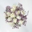 Presented is a vision of serene Oxford elegance-a harmonious cluster of creamy white roses embraced by wisps of lavender statice, brought together by a florist attuned to the pace and poetry of the city. Each rose, velvety and full, opens to reveal its gentle heart, reminiscent of the soft blooms that appear along the Botanic Garden paths each spring. The statice, with its curling branches and delicate papery florets, swirls like a morning mist beneath the dreaming spires. The contrast between the chalky white petals and the subtle violet haze lends quiet enchantment to the arrangement-pure, refined, and filled with promise. Natural daylight streaming into an Oxford sitting room illuminates the bouquet's purity, imbuing the space with a hopeful air-ideal for weddings, anniversaries, or heartfelt celebrations in places like North Oxford or Iffley. The mood is both calming and romantic, as if time itself slows to admire such simple beauty. A faint, lingering fragrance-powdery, gently herbal-evokes spring mornings along the Cherwell and the gentle hush of peaceful Oxford homes. The expert hands behind the design infuse sincerity and grace into every detail, crafting a bouquet that brings lasting affection and comfort to every recipient-always locally delivered with the kind of care that Oxford cherishes.