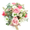 A rounded blush pink hatbox is transformed into a romantic floral display, photographed from above against a pure white background so that every flower appears clear and distinct. At the heart of the arrangement, light pink roses open in gentle spirals, some fully bloomed and others still half-cupped, their velvety layers creating a sense of softness and affection that feels ideal for marking special moments in Oxford. Encircling these are white daisy-like chrysanthemums, each bloom centred by a bright green eye that adds a lively spark and lifts the whole palette. Slender white alstroemeria are interspersed throughout, their petals brushed with fine purplish-red streaks and freckles, adding a sophisticated, almost artistic detail that suggests careful, experienced floristry. Cool, silvery-green eucalyptus leaves curl through the bouquet, their rounded shapes and muted colour lending a tranquil backdrop, while darker, narrow green foliage lends quiet structure and helps the dome shape feel full and balanced. Tucked among the petals are small reddish-brown buds or berry-like accents, which provide subtle contrast and a hint of woodland charm, like a nod to the tree-lined avenues of North Oxford. The hatbox itself is a soft, matte blush pink cylinder, trimmed with a slim reddish-pink satin ribbon that circles its middle, from which hangs a cream-coloured rectangular tag with a partially visible logo, hinting at a quality local florist. The finished look is polished yet inviting, perfect for birthdays, romantic gestures, or simply sending a warm, reassuring message with same-day flower delivery across Oxford.