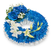 A serene, circular memorial wreath set against a clean white backdrop, composed of a dense carpet of deep cobalt-blue chrysanthemums that form a lush, textured ring. The chrysanthemums' fine, slightly fuzzy petals create a velvety surface that reads almost tactile, catching soft, diffused light so the blues shift from midnight to sapphire as you scan the circle. A pleated, ruffled white satin ribbon lines the inner opening and edges, its glossy folds lending a polished contrast and a quiet, ceremonial frame. At the upper-left quadrant three large blue roses bloom fully, their petals thick and velvety with a saturated azure that anchors the design; these are gently nestled among tiny, cloud-like sprays of white baby's breath and a few dark green leaves that add depth and a natural punctuation. From the mid-left the eye follows an elegant cascade of pristine white orchids-Phalaenopsis-like in form-with graceful, wafer-thin petals that arch toward the lower right, their porcelain surfaces catching highlights and lending an airy, almost ethereal movement across the compact blue base. Scattered along the orchid stem are fresh, vibrant green buds, some tight and others poised to open, symbolising continuity and quiet hope amid remembrance. The overall composition balances rich, somber blue with pure white accents to convey dignity, respect, and gentle comfort. In soft morning or chapel light this wreath reads as a composed tribute-textural, dignified, and thoughtfully proportioned-an arrangement suited to funerals or memorial services where calm presence and lasting memory are desired.