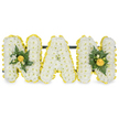 A meticulously modelled three-dimensional tribute spells the affectionate word 'NAN' in strong capital letters, fashioned for a funeral or remembrance service. Each letter is densely built from hundreds of small, pristine white chrysanthemum florets, giving the surface a cloud-soft texture and a quiet matte sheen. A bright, cheerful border of tightly packed yellow button chrysanthemums (or miniature carnations) traces the precise contours of every letter, the tiny yellow heads adding a lively, sunlit edge against the pure white base. The two outer 'N' letters are gently dressed with compact accent clusters: glossy deep-green leaves-reminiscent of camellia or ruscus-sit behind sprigs of fern-like foliage, while small buds of warm yellow blooms or tight rosebuds nestle into the greenery, introducing depth and a touch of warmth. The central 'A' remains unadorned, its simple white face surrounded only by the yellow outline so the arrangement reads clearly from a distance. A slim, dark green or black horizontal support bar is concealed behind the upper sections, stabilising the letters for standing display at a church service, graveside at Wolvercote or a family wake. The composition rests on a clean white background in the photo, so the contrast of yellow, white and deep green is crisp and easy to read. As a florist in Oxford, I choose these textures and tones to balance respect with a gentle brightness-the white chrysanthemum for purity and the yellow accents to suggest fond memories and warmth. The overall effect is dignified yet tender, a personal letter tribute that conveys love, remembrance and the familiar comfort of a cherished 'Nan' at a farewell service.