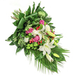 Radiating calm and grace, this hand-crafted funeral spray combines the finest blooms found near Oxford's famous Covered Market. Shown on a crisp white background, the bouquet's diagonal cascade draws the eye from the upper left to the graceful trailing fronds below, as if echoing the gentle flow of the Isis past University boat clubs. Central white lilies, with their creamy petals and golden-heart stamens, evoke a sense of peace and timeless beauty. Around them nestle clusters of rich pink roses, softly opening with a tender promise, framed by delicate ruffled white carnations for added texture and serenity. Bright green santini chrysanthemums break up the palette with modern flair and a playful, moss-like texture, while small, glossy red hypericum berries are dotted throughout, lending cheerful contrast. The base of lush green foliage is carefully layered-broad, dark leaves folded into crisp lines, intermixed with feathery sprigs and cascading palm fronds-to anchor the arrangement while suggesting gentle movement. Soft natural lighting accentuates the harmony of hues and the velvety quality of each petal, inviting reflection. This arrangement, ideal for expressing sympathy or remembering a loved one across Oxford's diverse neighbourhoods, is testament to the thoughtful artistry and local knowledge of seasoned Oxford florists.