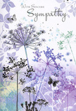 This sympathy card unfolds like a soft-spoken memory, the artwork capturing the same quiet reassurance you might find wandering alongside the river in Oxford at dusk. Across the card, slender wildflower silhouettes stretch upward, their fine umbelliferous heads drawn with almost thread-like detail in soothing shades of lavender, indigo, and powder blue. The stems are long and graceful, occasionally crossing and leaning, giving the impression of a gentle breeze moving through a meadow. Behind them, a dreamy wash of colour-muted purple, cool blue-grey, and whisper-soft green-blurs together like distant trees seen through evening mist along the paths near South Park. Scattered around the flowers, the faint suggestion of petals and leaves drifts across the background, as if memories themselves were floating in the air. Light, ethereal butterflies hover among the blooms, their wings barely tinted, bringing a subtle sense of transformation and continued presence. The overall mood is consoling rather than sombre, a quiet lull in the day where grief can rest for a moment. As a florist serving families across Oxford, I recognise the same tenderness in this design that we try to weave into each funeral arrangement: respect, compassion, and a calm beauty that never overwhelms. This is the sort of card you might send with a modest bouquet or a single, meaningful floral tribute, its gentle script and cool, comforting palette offering a silent embrace to someone navigating loss in Jericho, Headington, or beyond.