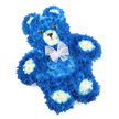 This image shows a carefully crafted floral teddy bear tribute, arranged flat against a pure white background so that its sweet, familiar silhouette stands out with clarity. The body, head, and limbs are completely covered in densely packed royal blue flowers, likely small chrysanthemums or similar florets, creating the impression of thick, luxurious fur. Each bloom nestles closely into the next, producing a rich, uniform blue surface that feels both soft and indulgent, like a favourite childhood teddy brought to life in petals. The bear's inner ears, snout, and the pads on all four paws are shaped from contrasting off-white and pale cream blossoms, adding a warm highlight and clearly defining its features. Two shiny, dark brown eyes with black centres sit symmetrically above a neat, black triangular nose, and a slender curved mouth line gives the teddy a gentle, contented smile. Around its neck, a delicate sheer white organza bow is tied in an elegant bow, the fine mesh catching tiny glints of light and softening the overall look. The bear is oriented slightly on the diagonal within the frame, introducing a sense of relaxed ease rather than formal rigidity. In Oxford, this kind of blue-and-cream floral teddy is often chosen by families from Headington, Marston, or near the John Radcliffe Hospital as a special funeral tribute, especially when honouring a baby boy or young child. The combination of calm blue and comforting teddy-bear shape creates a tender symbol of love, innocence, and remembrance, suitable for services, memorials, or a quiet moment of reflection at home.